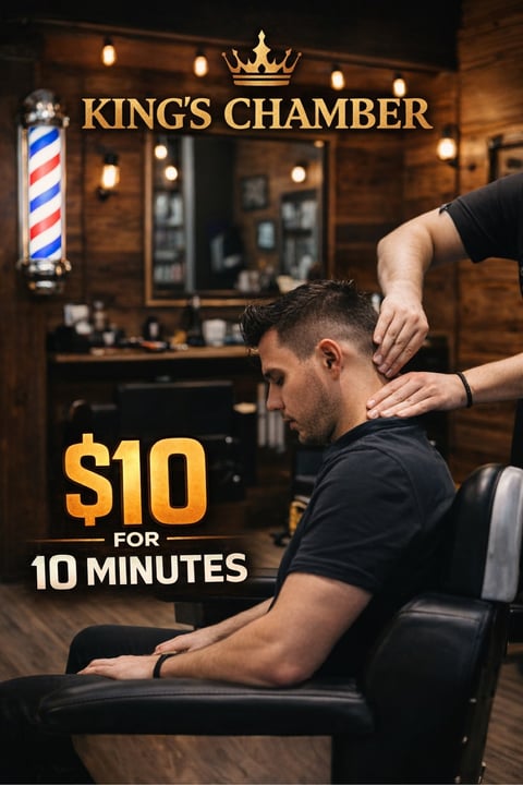 Man receiving neck massage at Kings Chamber barbershop with $10 for 10 minutes promotional offer displayed